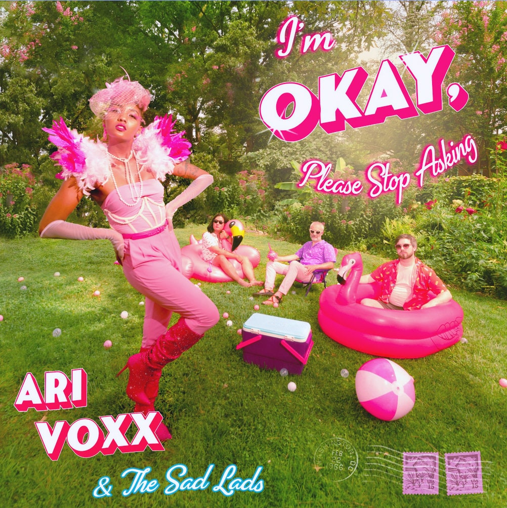 Ari Voxx - I'm Okay, Please Stop Asking - Album Art featuring the artist and her band in hot pink against a green garden landscape.